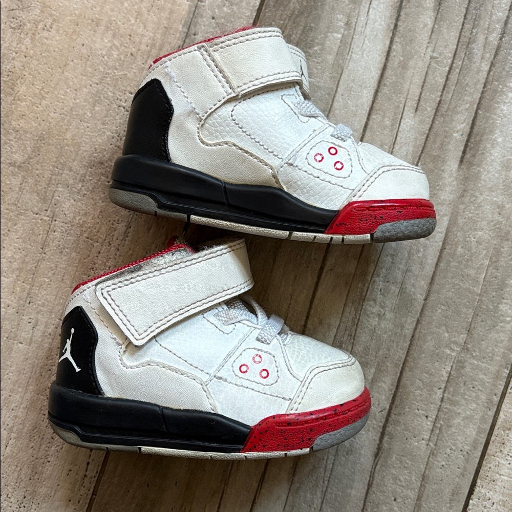 Jordan’s baby size 4 White and Red Sneakers